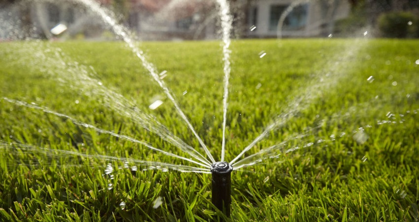 A irrigation on a home's front lawn